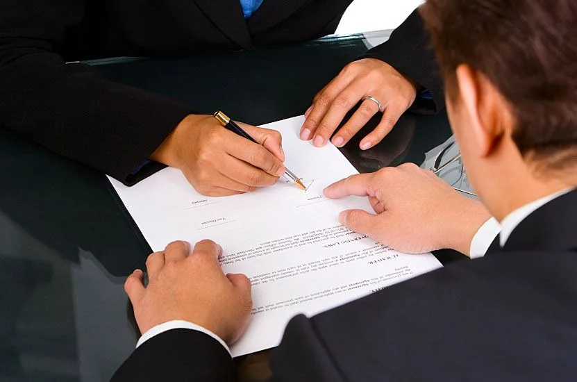 law_post_9-compressor Lawyer signing papers